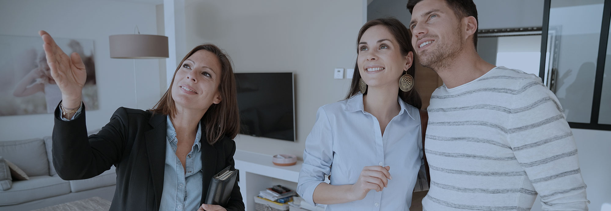 Woman Real Estate Agent and Couple